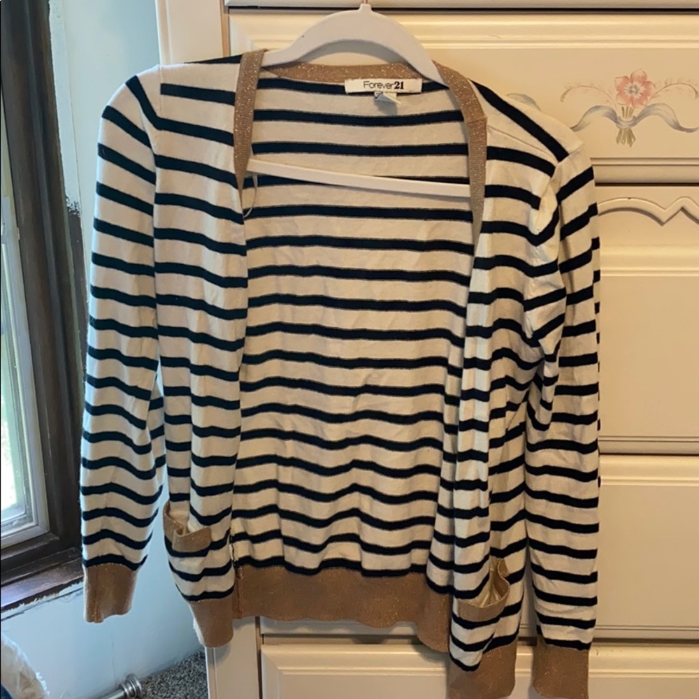 White and black striped cardigan with gold accents